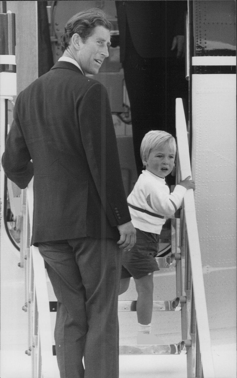 Prince William and his father Prince Charles headed for the flight to take them to London from Aberdeen. End of their vacation in Balmoral, Scotland. - Vintage Photograph