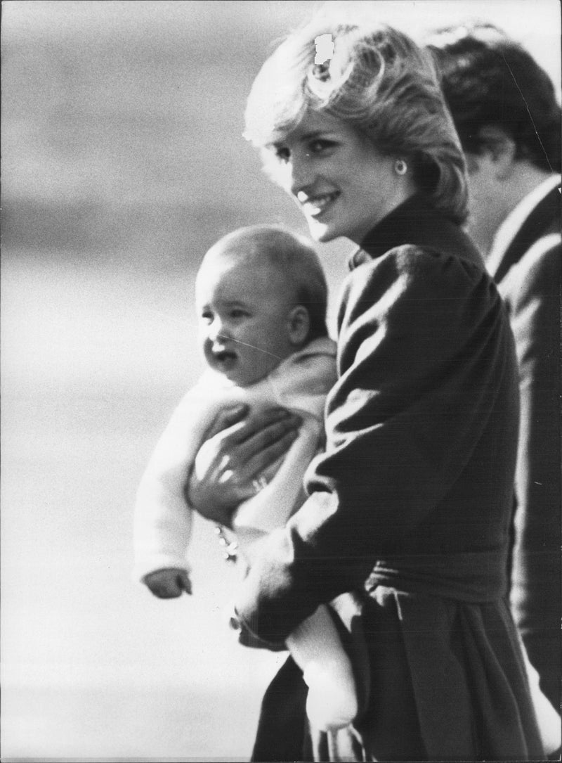 Princess Diana with her son, Prince William, 8 months old. They will fly to London after a holiday in Scotland. - Vintage Photograph