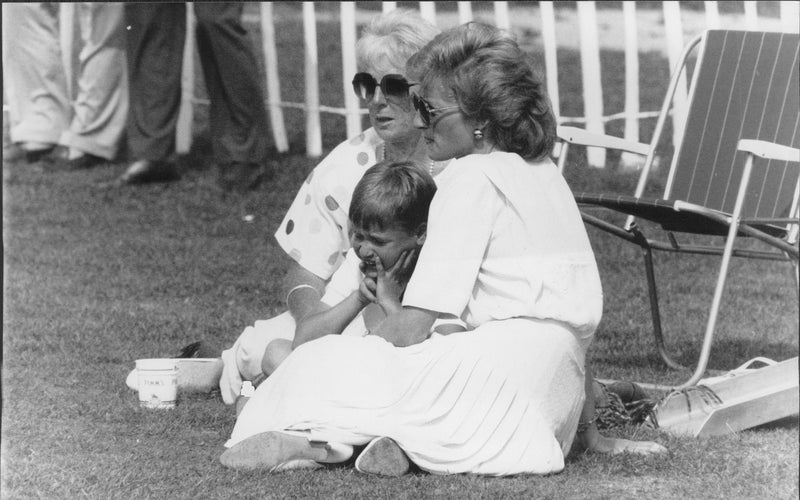Prince William together with his mother princess Diana. They watch when Prince Charles plays Polo at Smith's Lawn, Windsor. - Vintage Photograph