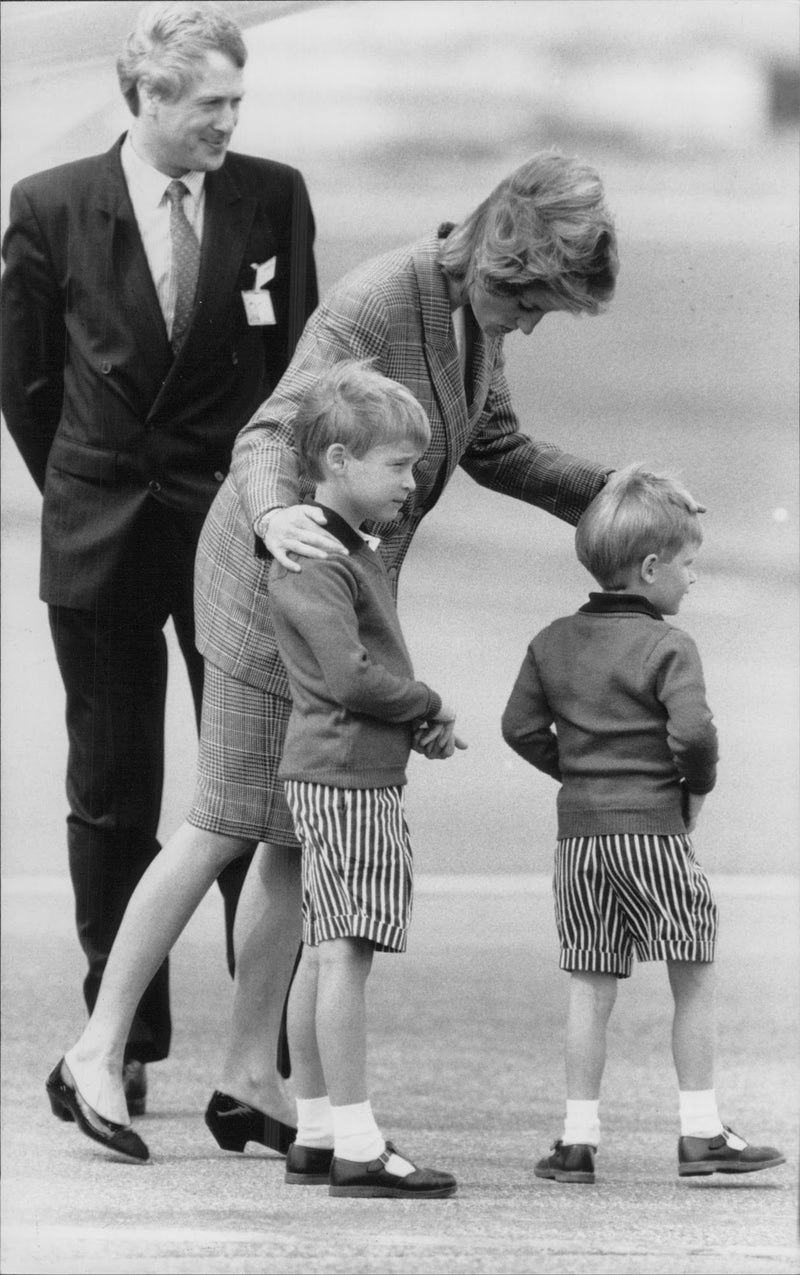 Princess Diana together with the sons Prince William and Prince Harry when they arrive in Scotland. - Vintage Photograph