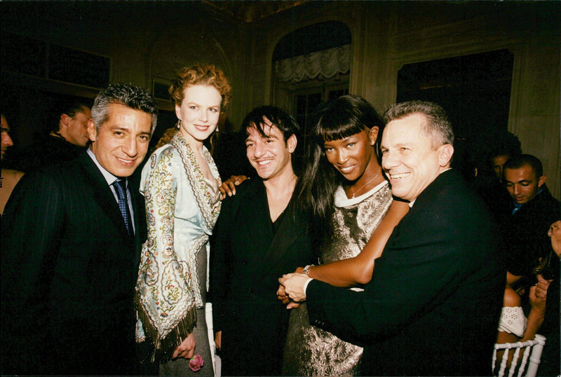 John Galliano surrounded by models at the Paris Fashion Week - Vintage Photograph