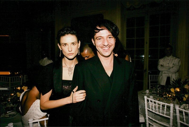 John Galliano surrounded by models at the Paris Fashion Week - Vintage Photograph