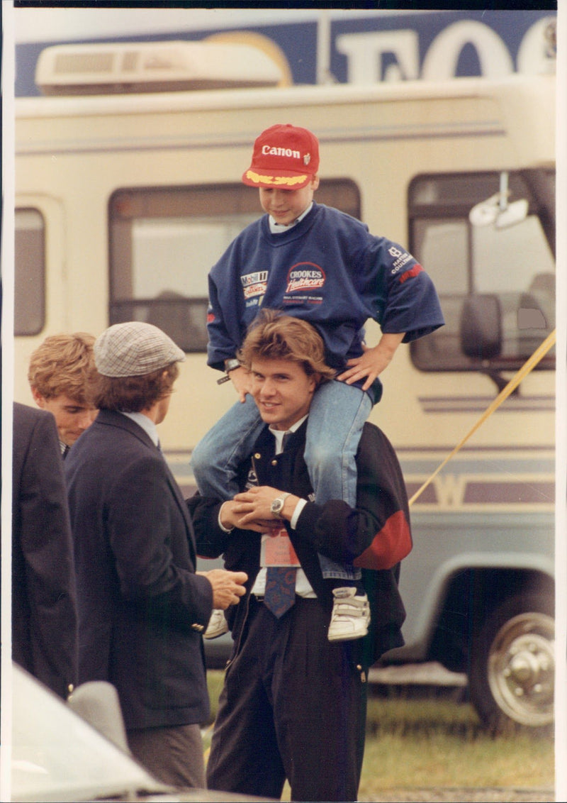 Paparazzi fire on Prince William taken in an unknown context. - Vintage Photograph