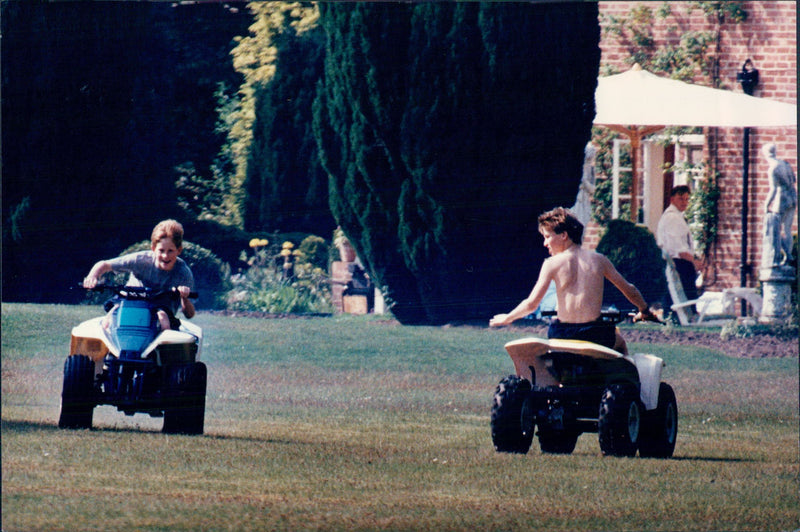 Prince William and Prince Harry run together on their fortified Sarah's rented farm in Surrey. - Vintage Photograph