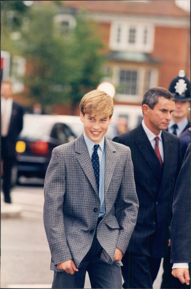 First school day at Eton's private school for Prince William. Behind him is housekeeper Dr ANdrew Gailey seen. - Vintage Photograph