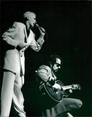 Concert image of Dave Stewart and Annie Lennox in the Globe. - Vintage Photograph