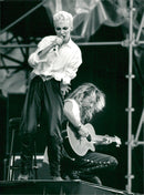 Concert image of Dave Stewart and Annie Lennox from the gig at Stockholm Stadium. - Vintage Photograph