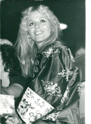 Actress Britt Ekland looks at Boyfriend Rod Stewart's concert at Belle Vue. - Vintage Photograph