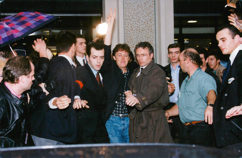 Paul McCartney tries to avoid the crowd - Vintage Photograph