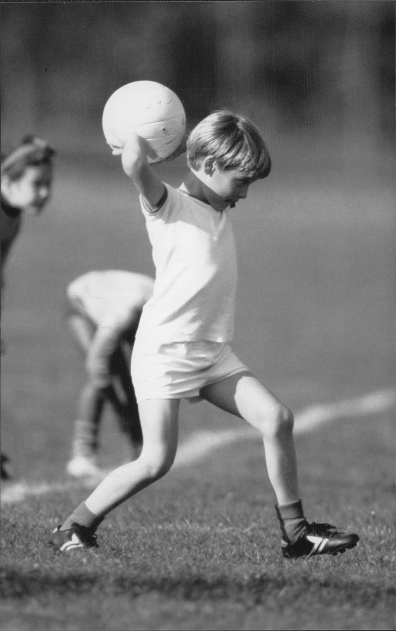 Prince William plays football at the schoolyard - Vintage Photograph