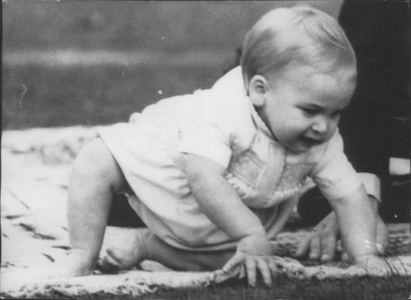 1-year-old Prince William tries to read himself - Vintage Photograph