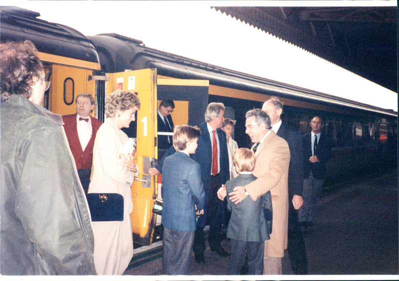 Princess Diana, Prince William and Prince Harry are waiting to board. - Vintage Photograph