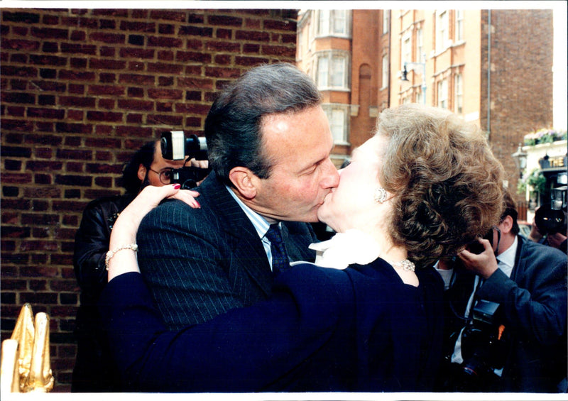 Princess Diana's stepmother, Lady Raine Spencer, kisses her husband - Vintage Photograph