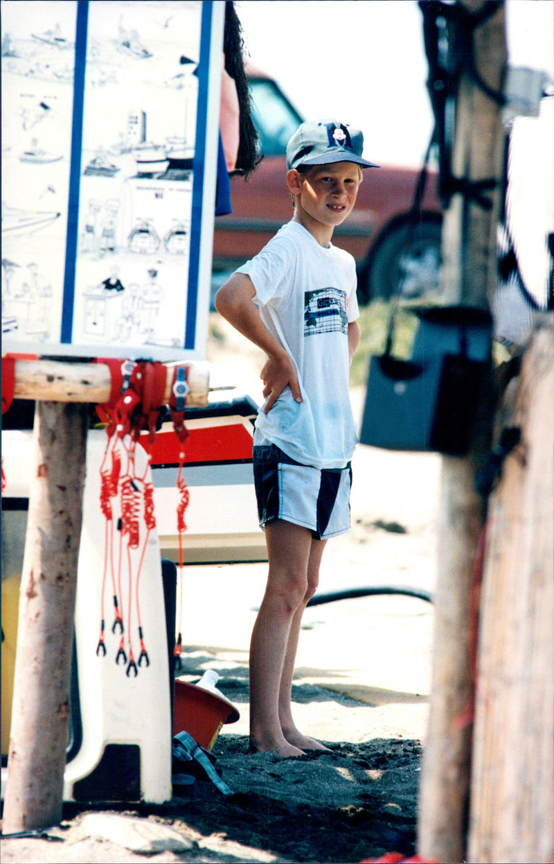 Prince Harry is on holiday in Marbella, Spain, together with his brother Prince William and mother princess Diana. One day at the beach. - Vintage Photograph