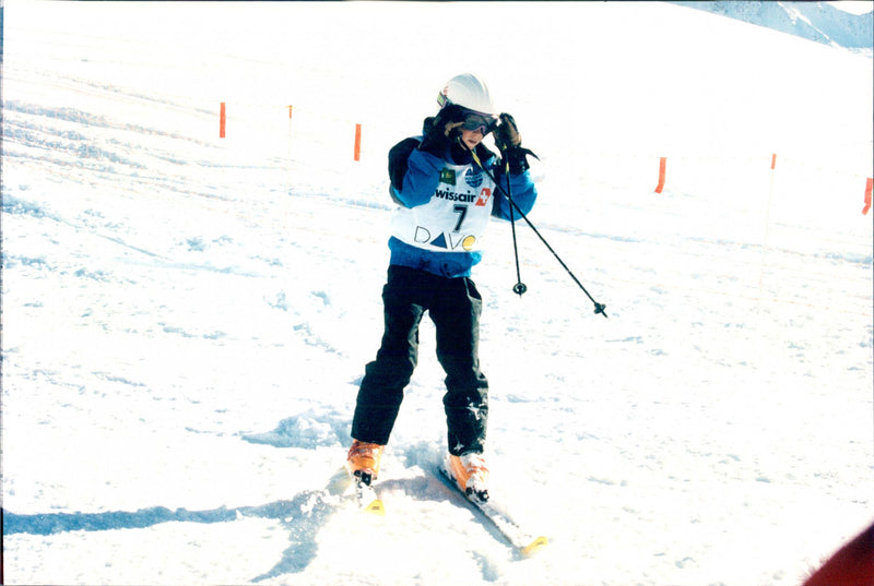 Prince Harry photographed at the royal family's annual skiing holiday in Klosters, Switzerland. He and Prince Charles, his father, participated in a slalom race. - Vintage Photograph