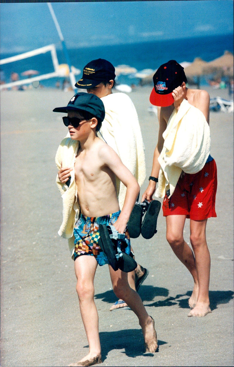 Prince Harry and Prince William during a Costa del Sol vacation together with Princess Diana. - Vintage Photograph