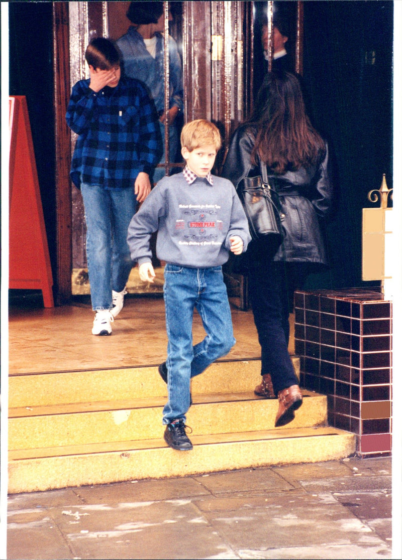 Prince Harry takes the lead when he, Prince William and Princess Diana leave the US food joint in Knightbridge. - Vintage Photograph