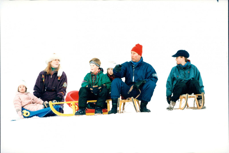 Prince Charles with the sons William and Harry play in the snow with Fergie and her daughters Beatrice and Eugenie - Vintage Photograph