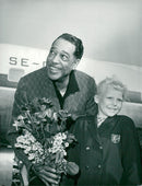 Duke Ellington is welcomed by eight-year-old Synnöve Edberg on arrival at Arlanda - Vintage Photograph