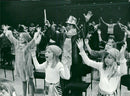 Hasse Funck and his mini-maxi funckers participate in the SOS Children's Cities Friends' Concert Show in the Concert Hall. - Vintage Photograph