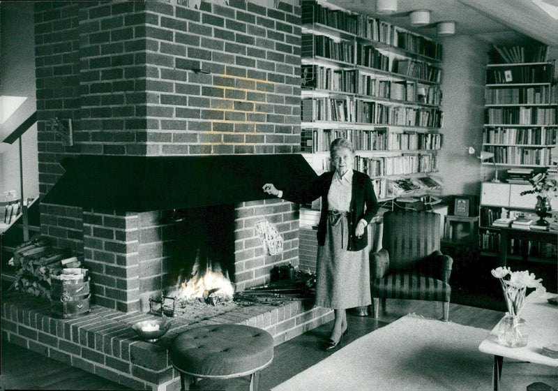 Politician Alva Myrdal next to his fireplace - Vintage Photograph