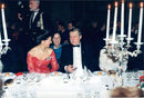 Queen Silvia talks with President Lech Walesa during the royal dinner at the concert hall. - Vintage Photograph