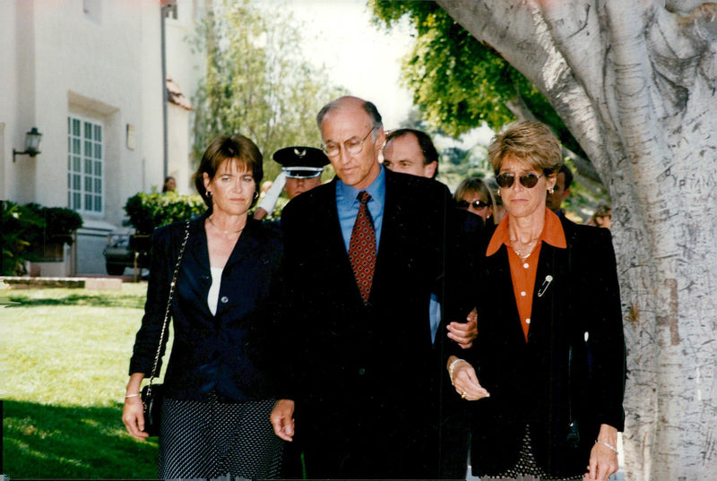 Michael McLean flanked by the twins Kelly Harcourt and Judy Merrill at James Stewart&