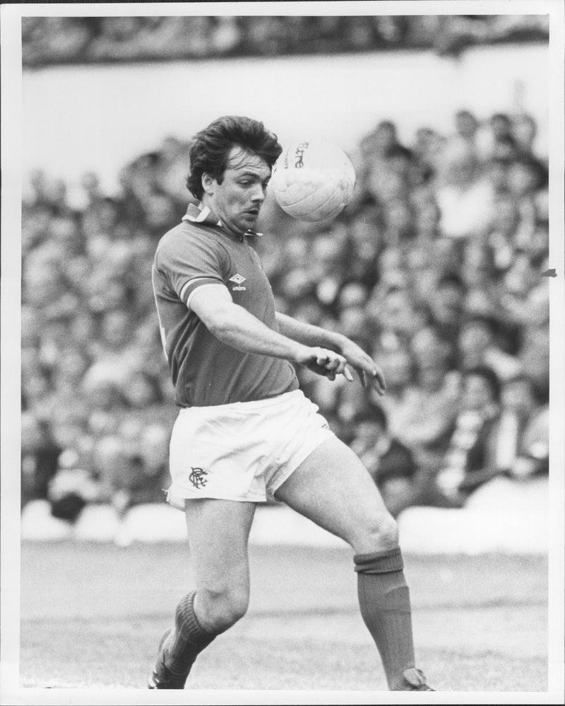 Football player Derek Johnstone is signed and is now playing with Rangers. - Vintage Photograph