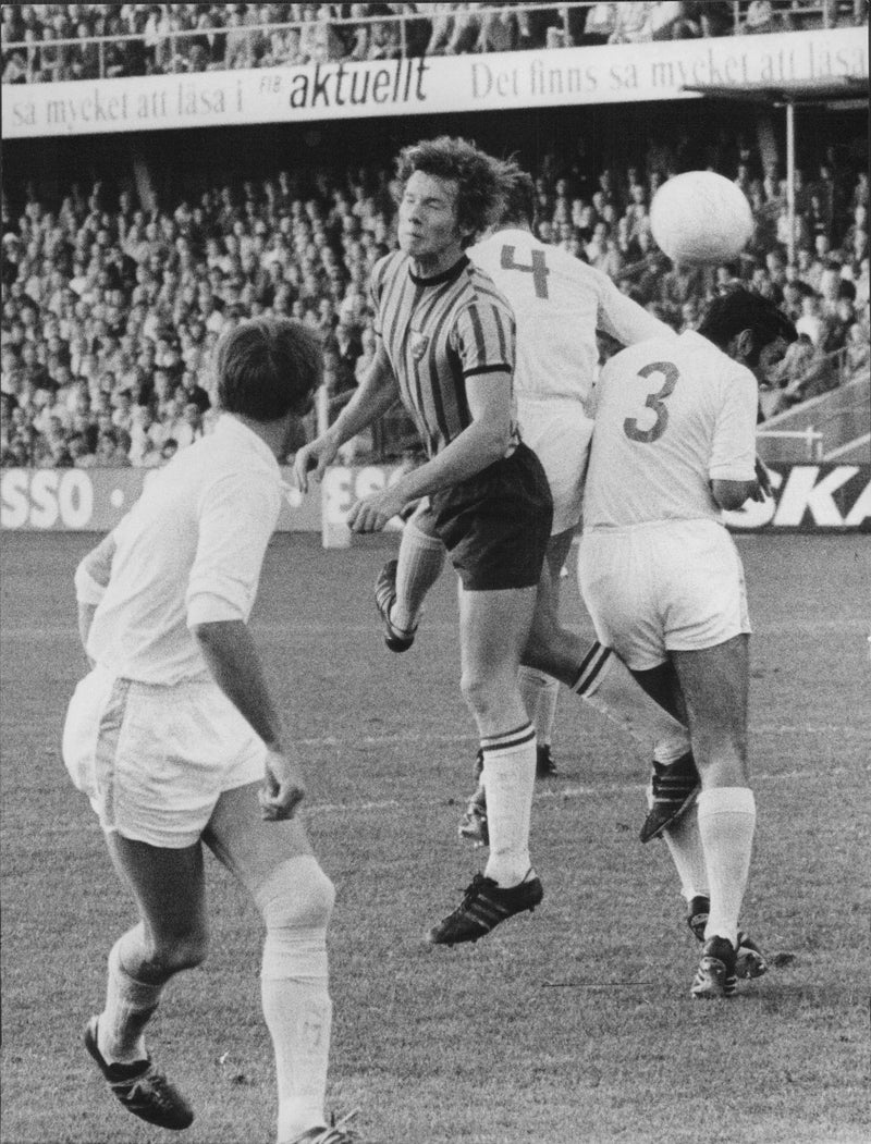 Football player Hans Jonsson in close combat against three opponents. - Vintage Photograph