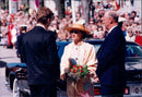 Queen Sonja and King Harald arrive at the annual music festival in Bergen. - Vintage Photograph