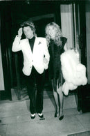Rod Stewart and his wife Alan headed out in Paris night to celebrate his 34th birthday. - Vintage Photograph