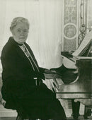 Selma LagerlÃ¶f plays the piano - Year 1935 - Vintage Photograph