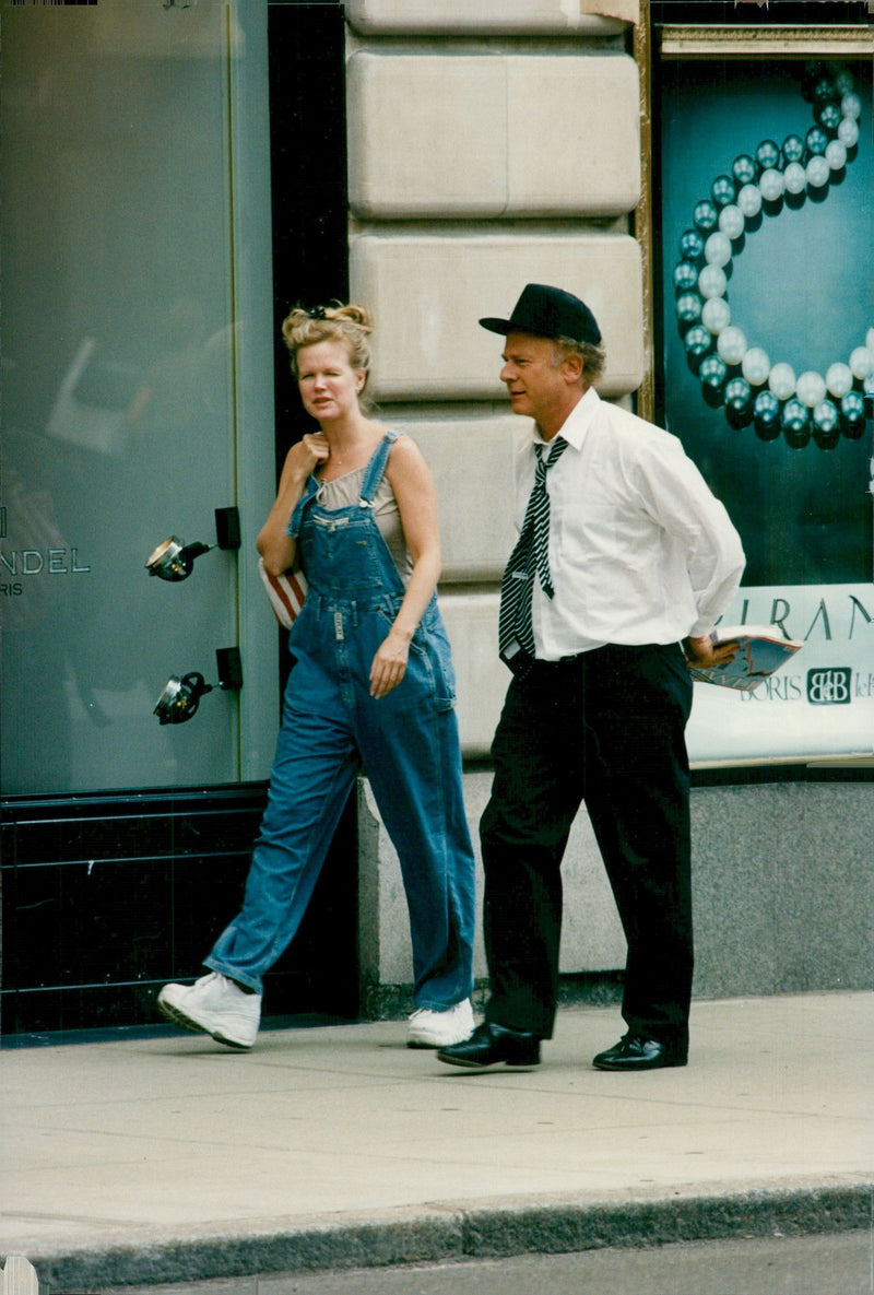 Art Garfunkel along with his wife Kathryn (Kim) Cermack Garfunkel during a shopping trip along Madison Avenue. - Vintage Photograph