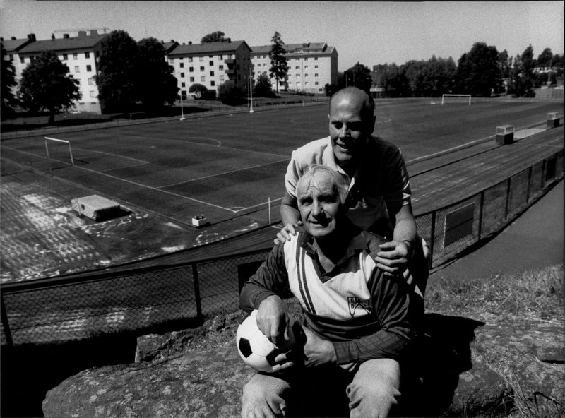 Football player Rune Jacobsson in GÃ¥rda BK stands in front of the team treasurer and eldsjÃ¤l, BÃ¶rje Larsson. - Vintage Photograph