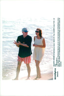 Steve Martin and the model model Stephanie Seymour on the walk along the sea while on holiday in Saint-BarthÃ©lemy - Vintage Photograph