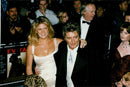 Singer Rod Stewart along with his wife Rachel Hunter during the premiere of &quot;Evita&quot;. - Vintage Photograph