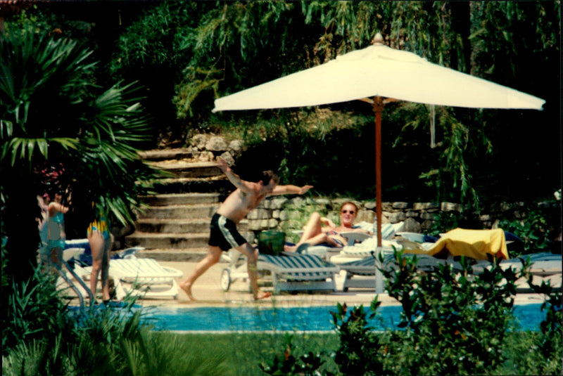 Sarah Ferguson is sunbathing next to the pool at a friend of the French Riviera - Vintage Photograph