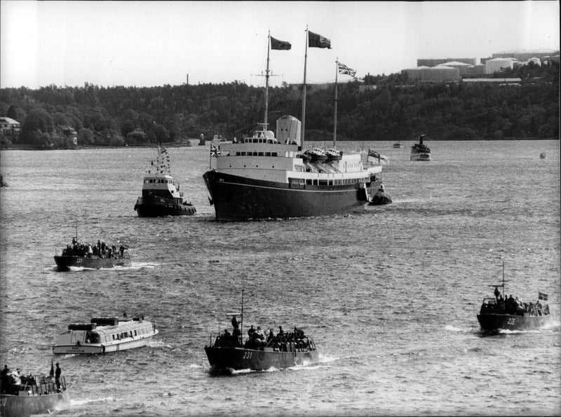 The Britannia ship accompanied by smaller boats - Vintage Photograph