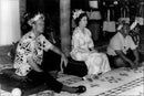 Prince Philip and Queen Elizabeth during royal feast at Vaiaku Maneapa in Tuvalu - Vintage Photograph