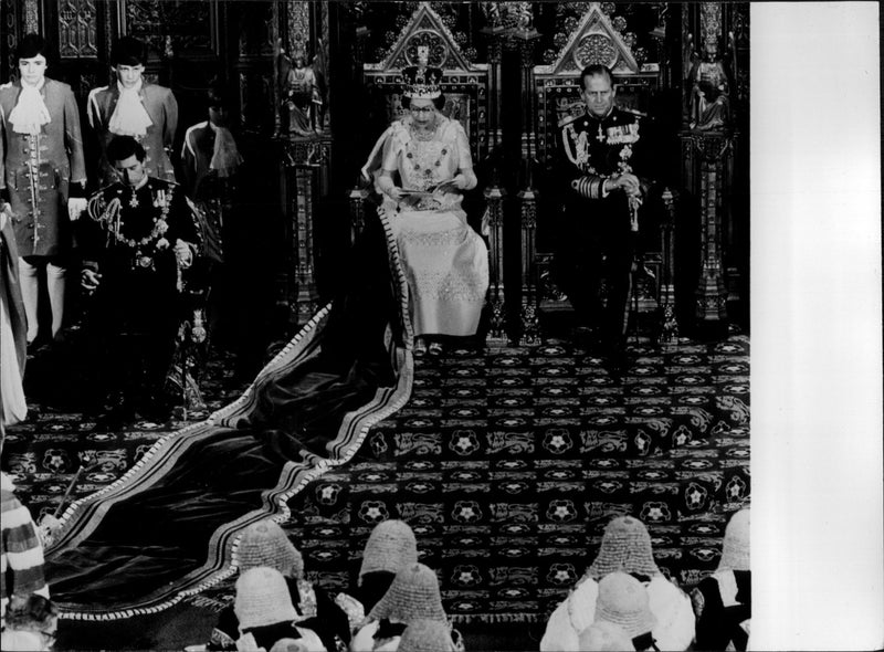 Queen Elizabeth II is speaking at the opening of parliament. By her side, Prince Philip. - Vintage Photograph