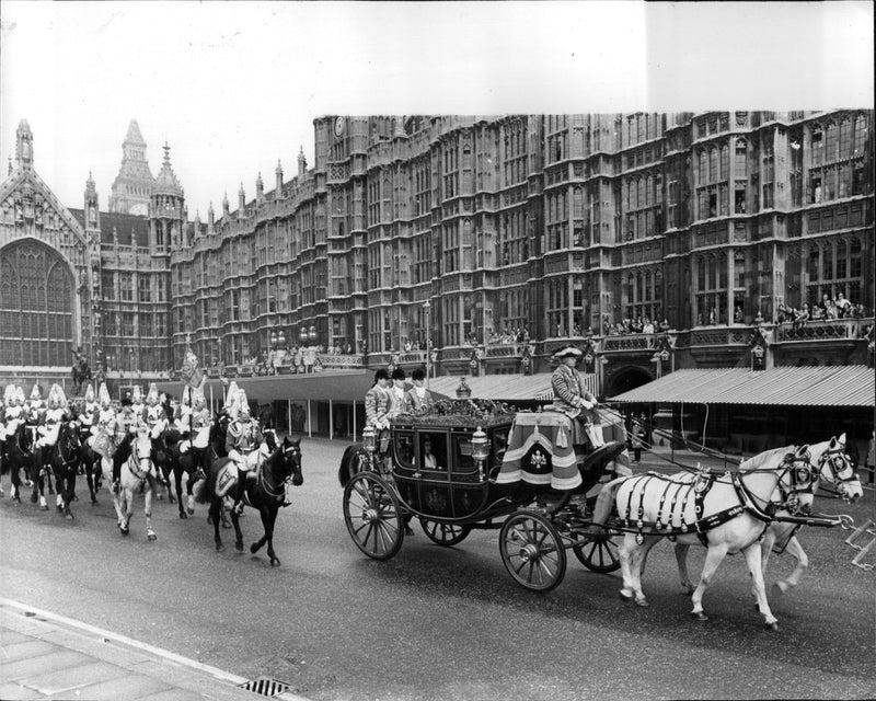 Queen Elizabeth II and Prince Philip arrive briefly at the opening of parliament. - Vintage Photograph