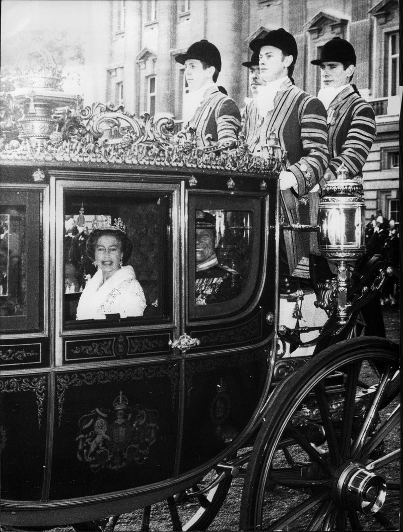 Queen Elizabeth II and Prince Philip arrive briefly at the opening of parliament. - Vintage Photograph