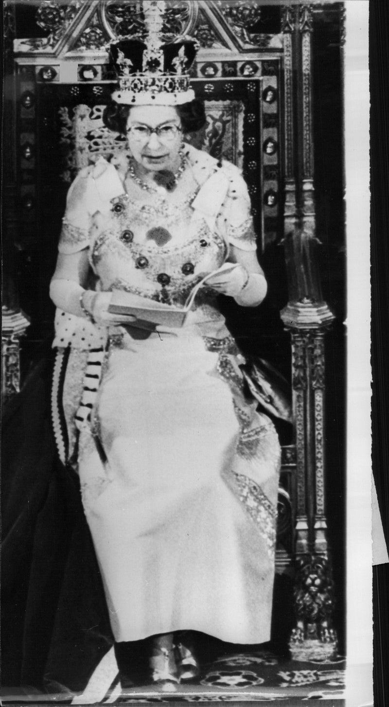 Queen Elizabeth II is speaking at the opening of parliament. - Vintage Photograph