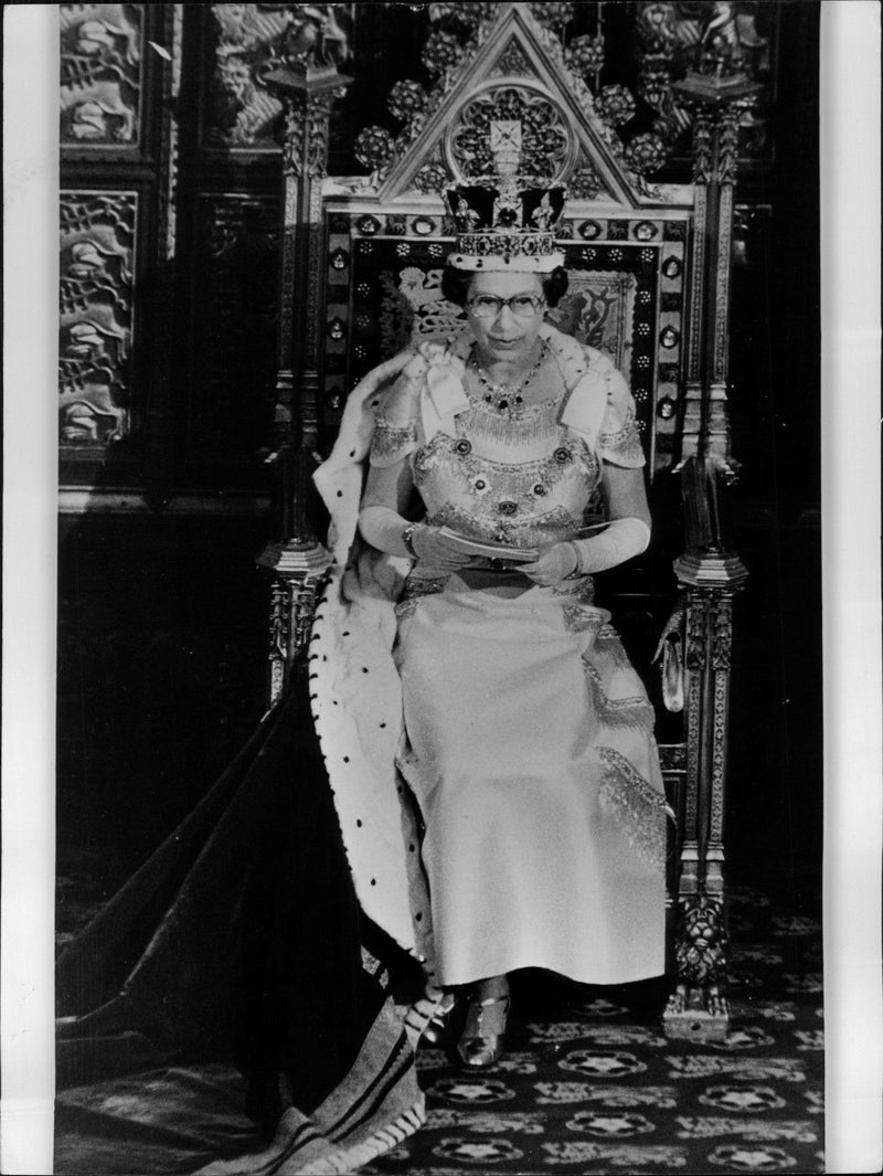 Queen Elizabeth II is speaking at the opening of parliament. - Vintage Photograph