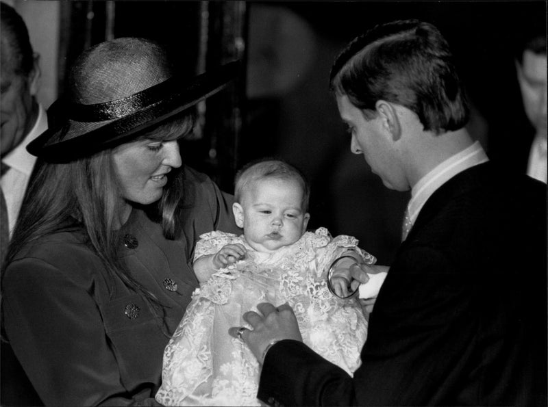 Prince Andrew and Sarah under the baptism of their daughter, Princess Beatrice of York. - Vintage Photograph