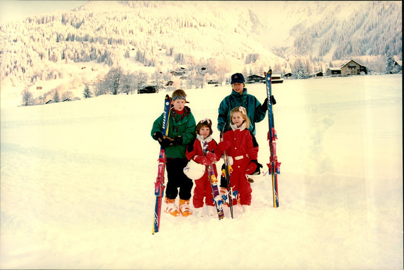 Princess sisters Beatrice and Eugenie together with the cousins ââPrince Harry and Prince William during a skiing holiday in Switzerland. - Vintage Photograph