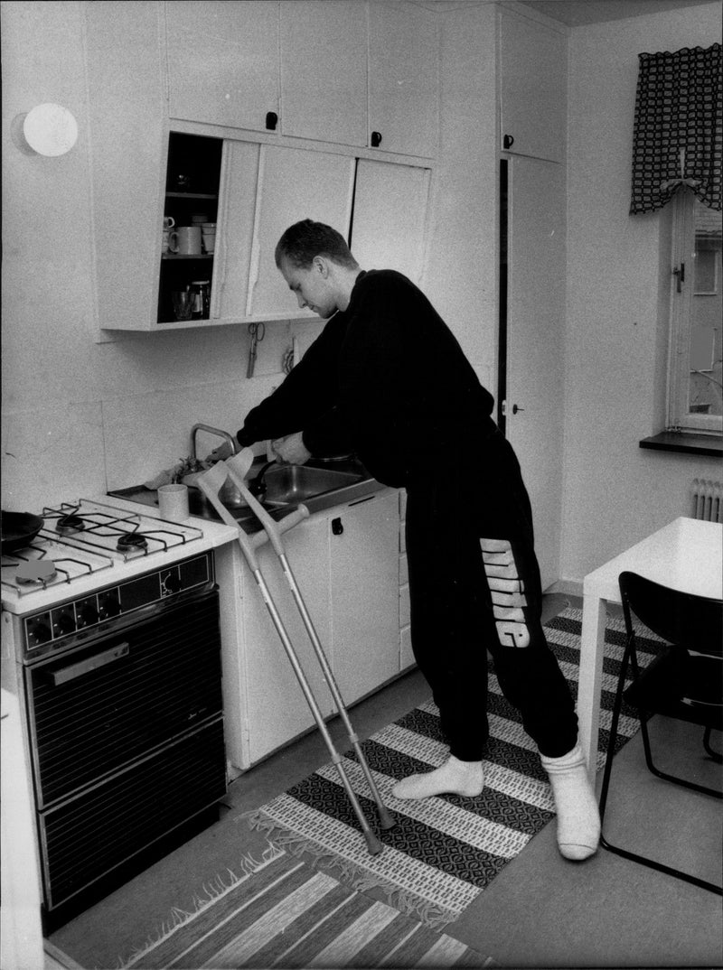 Football player Mikael Martinsson is at home with broken legs - Vintage Photograph