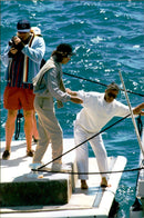Mick Jagger in helping a friend aboard the boat to Cannes - Vintage Photograph