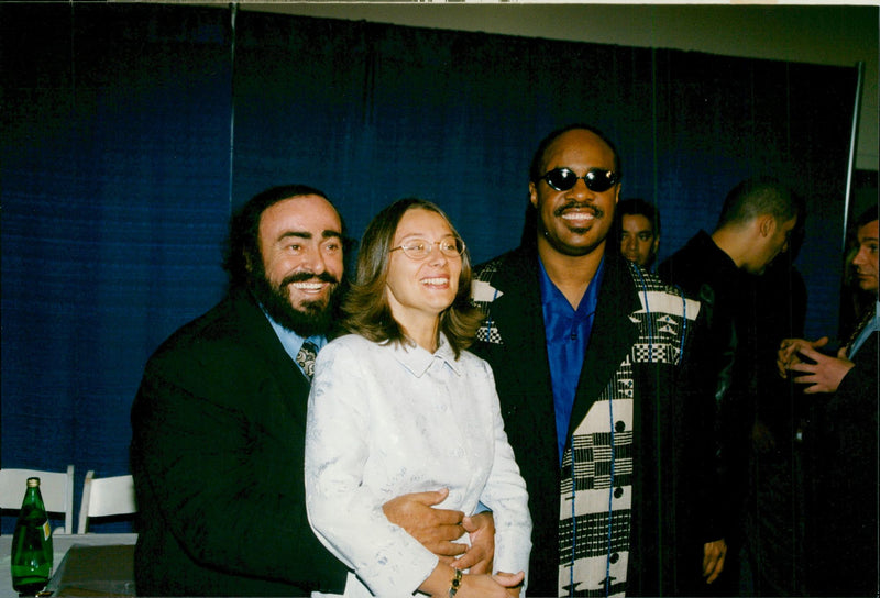 Luciano Pavarotti, his girlfriend Nicoletta Mantovani and Steve Wonder taken in an unknown context. - Vintage Photograph