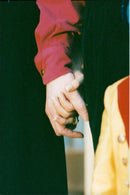 Newlywed couple Michael Jackson and Lisa Marie Presley hold hands when they leave Bethesda Hospital after visiting a sick boy - Vintage Photograph